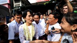 Myanmar democracy icon Aung San Suu Kyi greets her supporters after her press conference on the anniversary of her release at the National League for Democracy (NLD) headquarter in Yangon on November 14, Myanmar.
