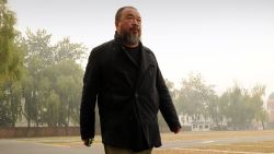 Chinese artist Ai Weiwei exercises in a car park in Beijing on November 16, 2011.