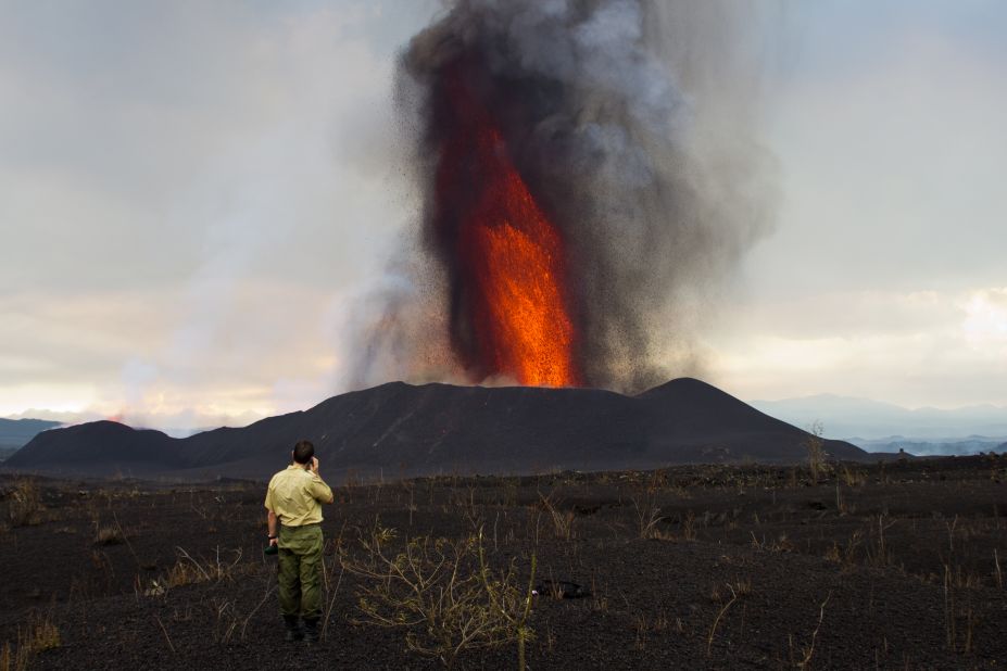 Park ranger Emmanuel stands in the closest area deemed safe by volcanologist Dario Tedesco.