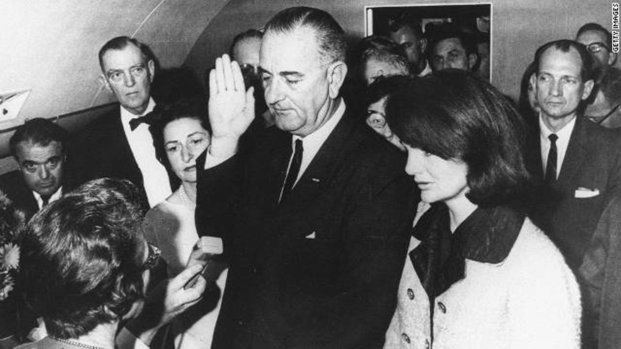 Sarah Hughes, lower left, became the only woman to preside over a presidential oath when she swore in Lyndon Johnson.
