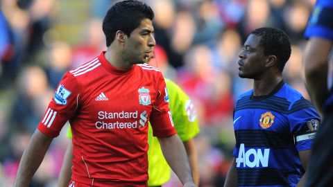 Luis Suarez (L) and Patrice Evra clashed during the game between Liverpool and Manchester United in October. 