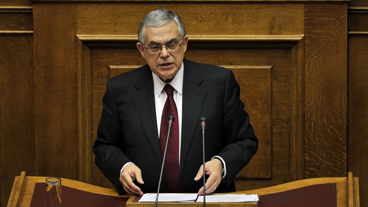 Greek Prime Minister Lucas Papademos speaks to members of the Parliament in his first address to Parliament since taking office.
