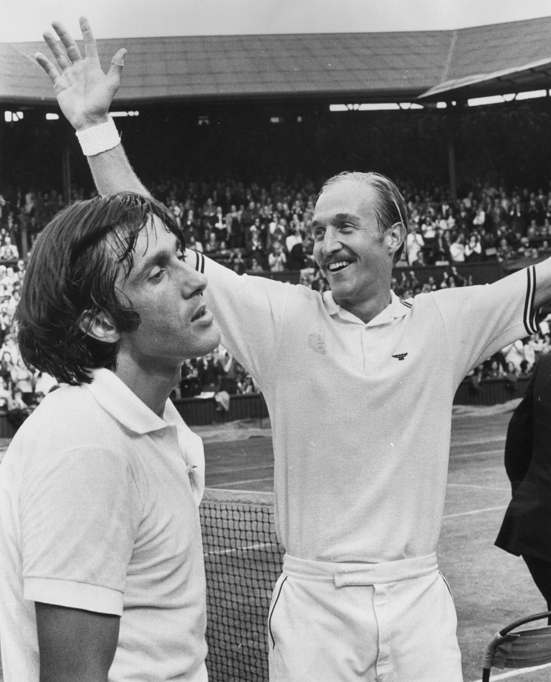 American Stan Smith, right, with  Nastase, his beaten opponent in the 1972 Wimbledon final.
