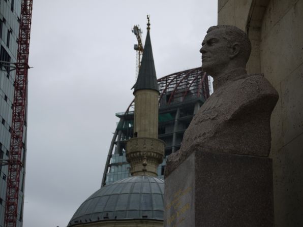 This image -- with the bust of a former army General in the foreground, the minaret of an old mosque and the construction of a new skyscraper in the background -- captures the contrasting ages of Azerbaijan, says Ida H?ltzel.