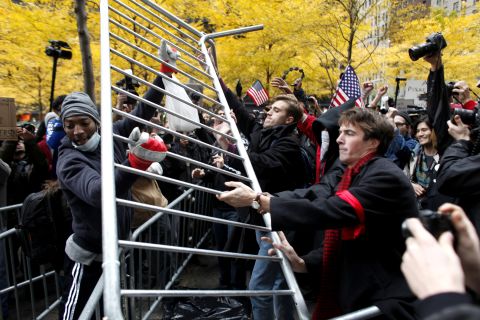 Protesters remove metal barricades Thursday in Zuccotti Park, where they had been evicted two days earlier.