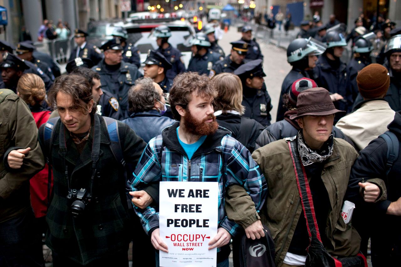 Occupy Wall Street protesters lock arms at an intersection in New York's Financial District.