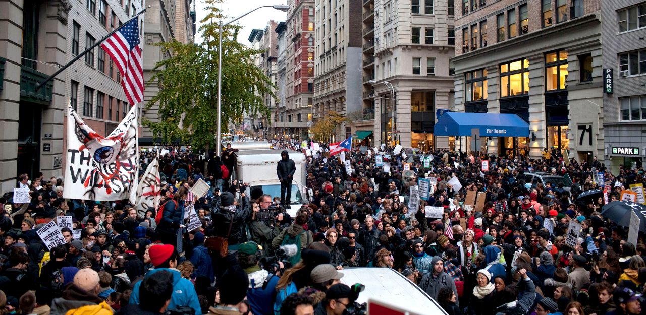 Thousands of demonstrators deluged the city, marking two months since the activist effort began in Lower Manhattan.