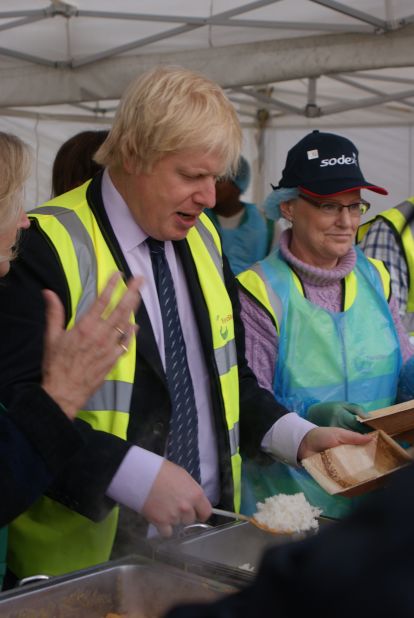 Mayor of London Boris Johnson dishing up some food at the event. Many of the ingredients are considered waste by restaurants, businesses and retailers. Speaking at the event, Johnson spoke of the practice of throwing away misshapen ingredients saying: "Don't discriminate against mutant vegetables."