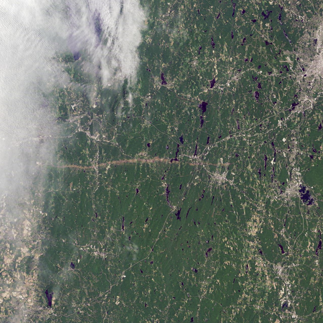 The thin horizontal strip of brown snaking across this NASA satellite image is the trail of destruction caused by a <a href="http://earthobservatory.nasa.gov/IOTD/view.php?id=50854" target="_blank" target="_blank">tornado on June 1</a> as it tore across southwest and south-central Massachusetts.  It continued for 39 miles (63 kilometers), says NASA, and in some places measured half-a-mile in diameter. The WMO reports that it was one of the most active tornado seasons on record. 157 people lost their lives -- the deadliest in the U.S. since 1947 -- in <a href="http://edition.cnn.com/2011/OPINION/05/29/hunter.tornado.joplin/index.html">Joplin, Missouri</a> in May.     