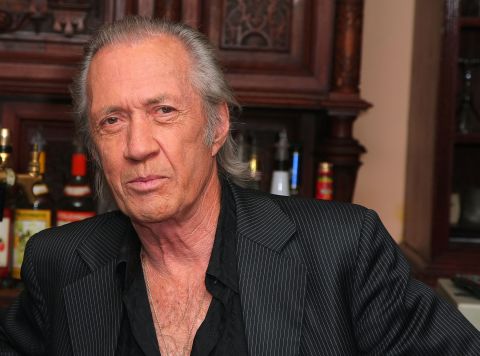 The body of "Kill Bill" actor David Carradine was found hanged in a Bangkok hotel room closet on June 4, 2009. He died at the age of 72. At first, officials ruled his death a suicide. They later said he died from accidental  asphyxiation.