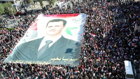 Supporters of Syrian President Bashar al-Assad rally in Damascus on Sunday.