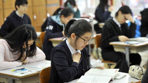 File photo: South Korean students prepare to take a standardized college entrance exam in Seoul on November 10, 2011. 