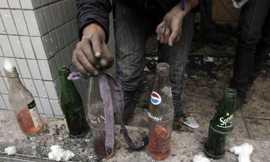 An Egyptian protester prepares Molotov cocktails Wednesday near Tahrir Square.