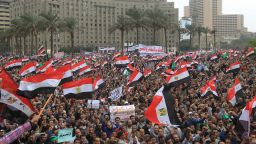 Tens of thousands of Egyptian protesters wave national flags during a rally in Cairo's Tahrir Square on November 18, 2011.  