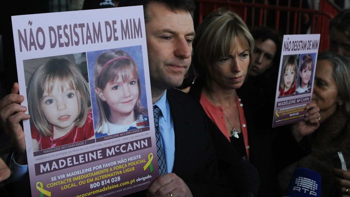 Gerry McCann and his wife, Kate, hold signs showing their missing daughter, Madeleine, in Lisbon in February 2010.