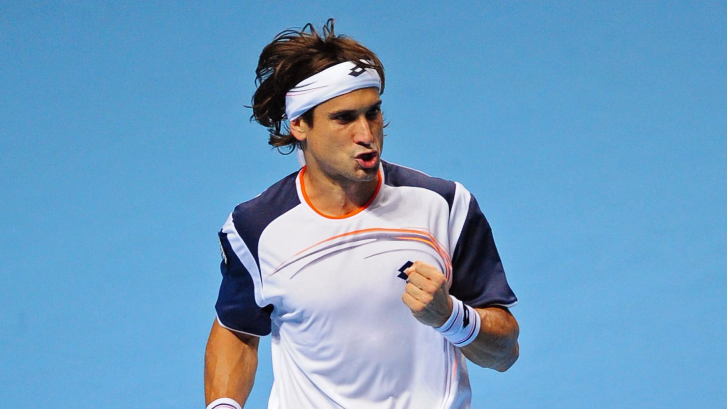 David Ferrer celebrates his stunning stright sets victory over Novak Djokovic in London.