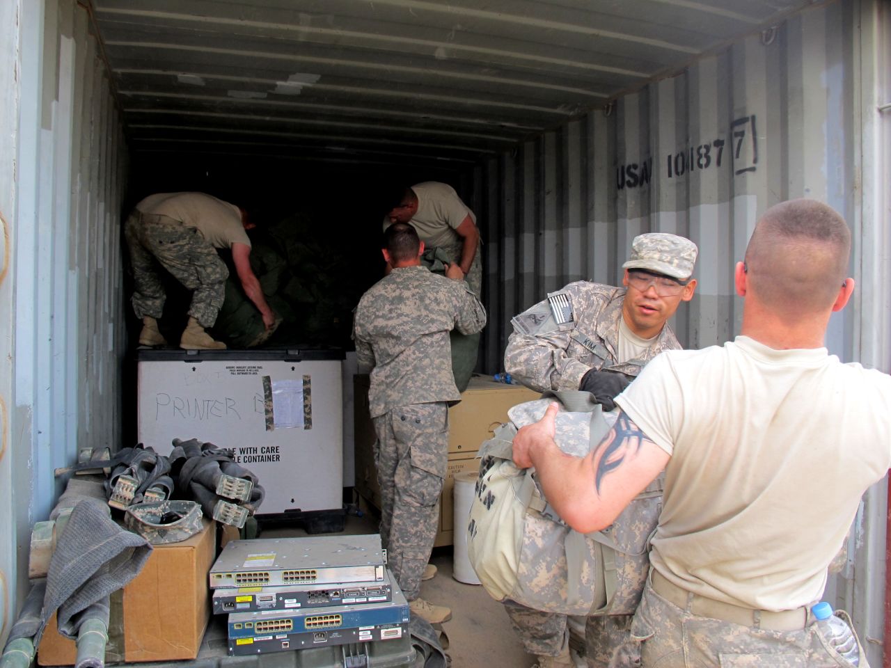 Troops in Kuwait load gear at Camp Virginia, which is located a short distance from the border crossing used in the 2003 invasion that toppled Saddam Hussein.
