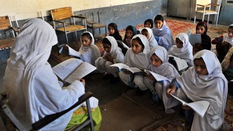 A female teacher gives a lesson at a girl's school in the main town of Swat valley, Pakistan on August 1, 2009.