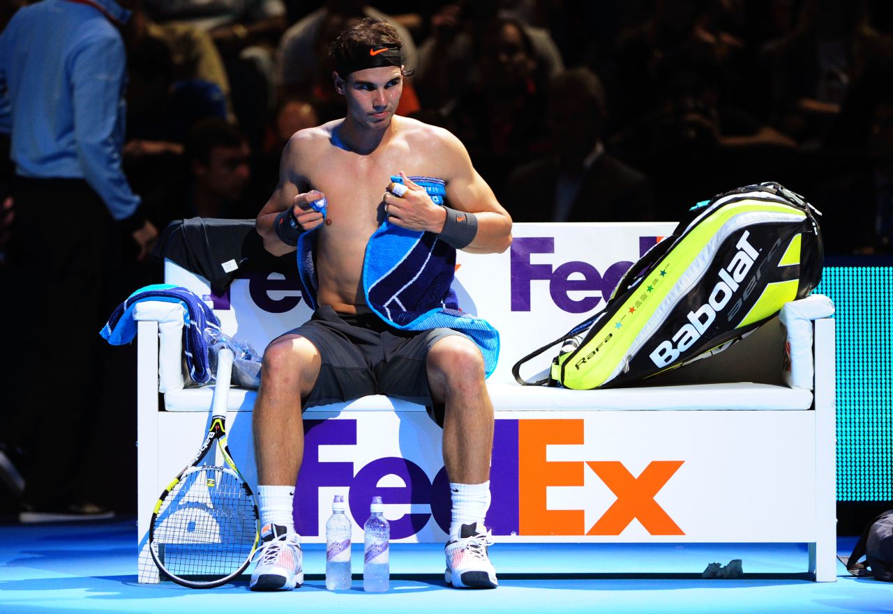 The event provides good exposure for sponsors such as FedEx, which has naming rights for the players' benches. World No. 2 Rafael Nadal towels himself dry as he changes his shirt during his opening win against Mardy Fish.