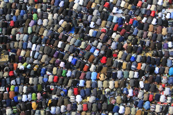 Demonstrators in Tahrir Square kneel during Friday prayers. Egypt's military rulers named Kamal Ganzouri to serve as prime minister until at least January, when parliamentary election results should be finalized.