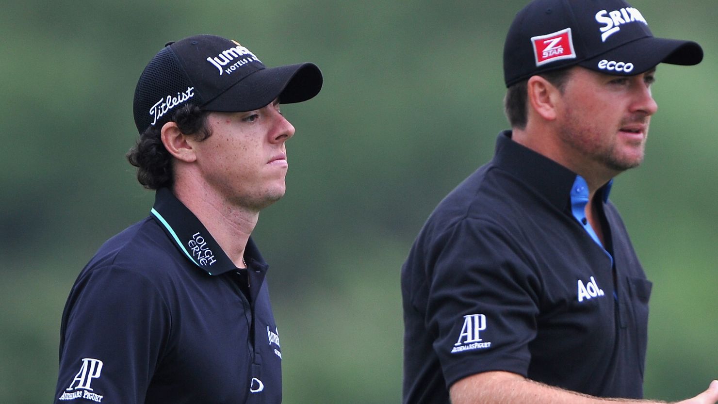 Rory McIlroy and Graeme McDowell march forward during their second round 68 in China