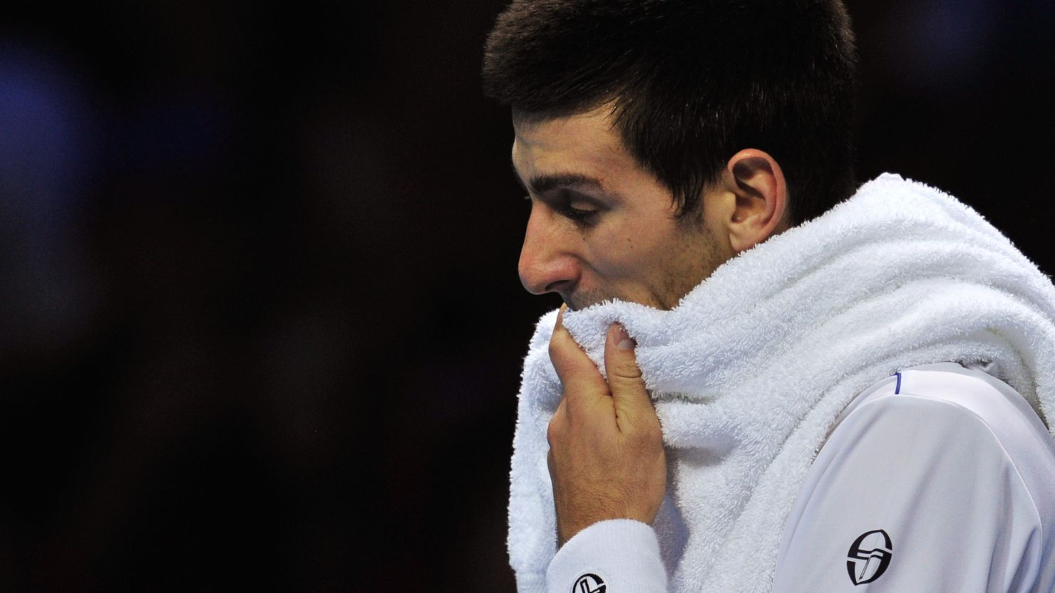 Novak Djokovic slips to defeat against Serbian compatriot Janko Tipsarevic at the O2 Arena.