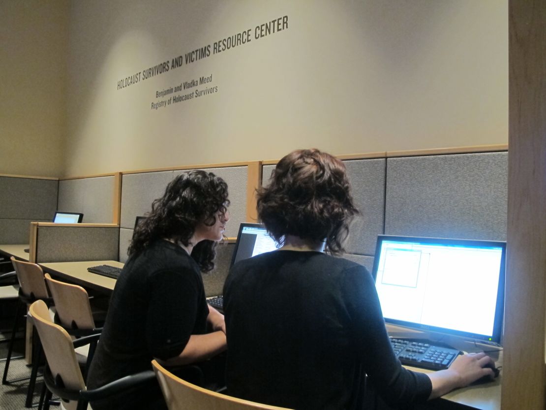 Sara Clark, left, and Andrea Bertrand index documents as part of the World Memory Project.
