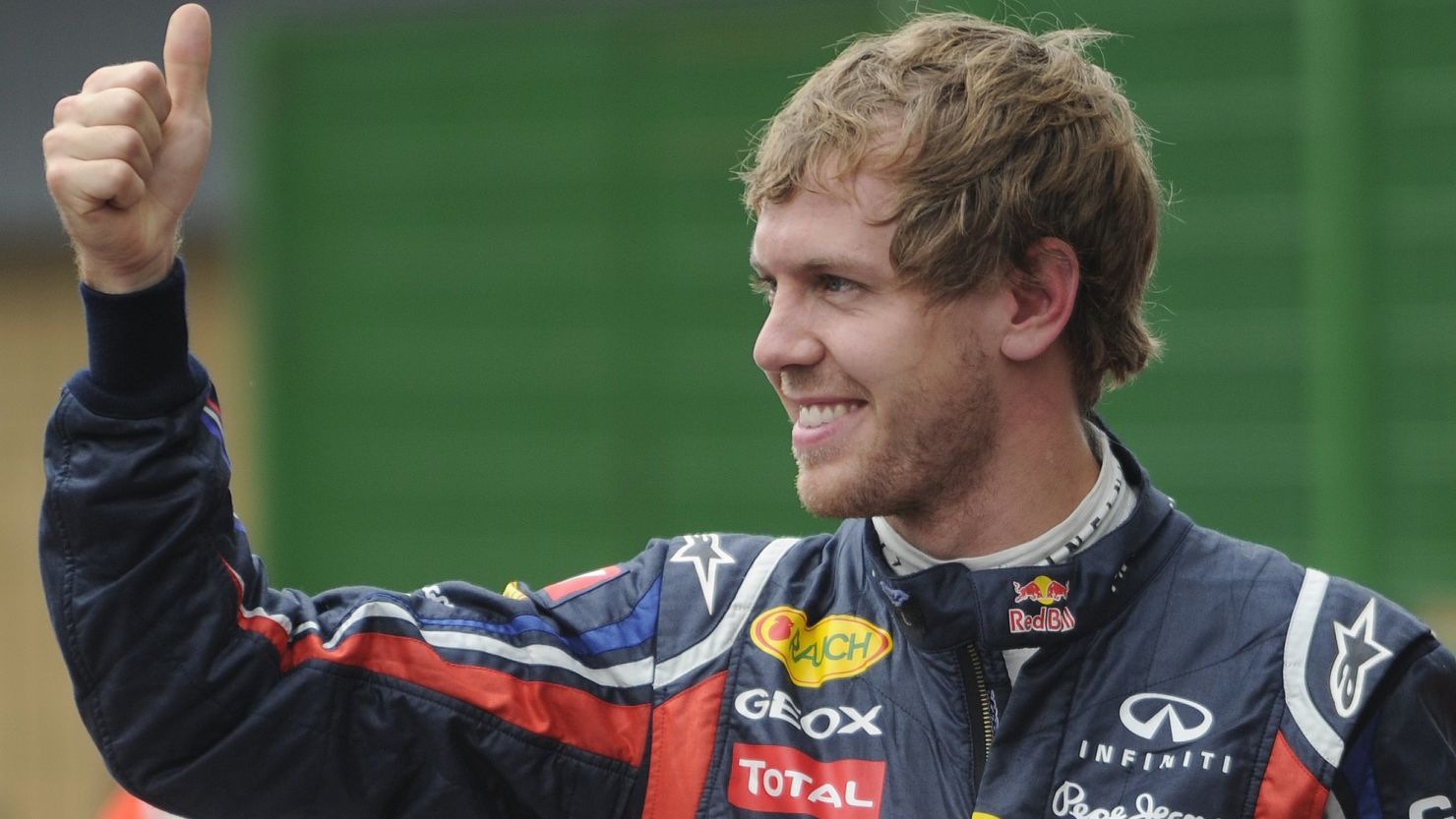 World champion Sebastian Vettel celebrates winning his record 15th pole position this season at Interlagos on Saturday.