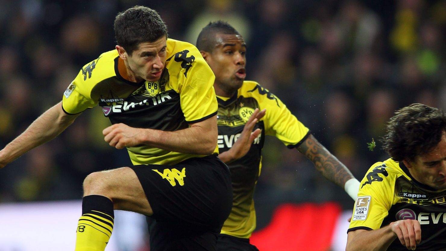 Robert Lewandowski scores Dormtund's first goal during the Bundesliga win over Schalke at Signal Iduna Park.