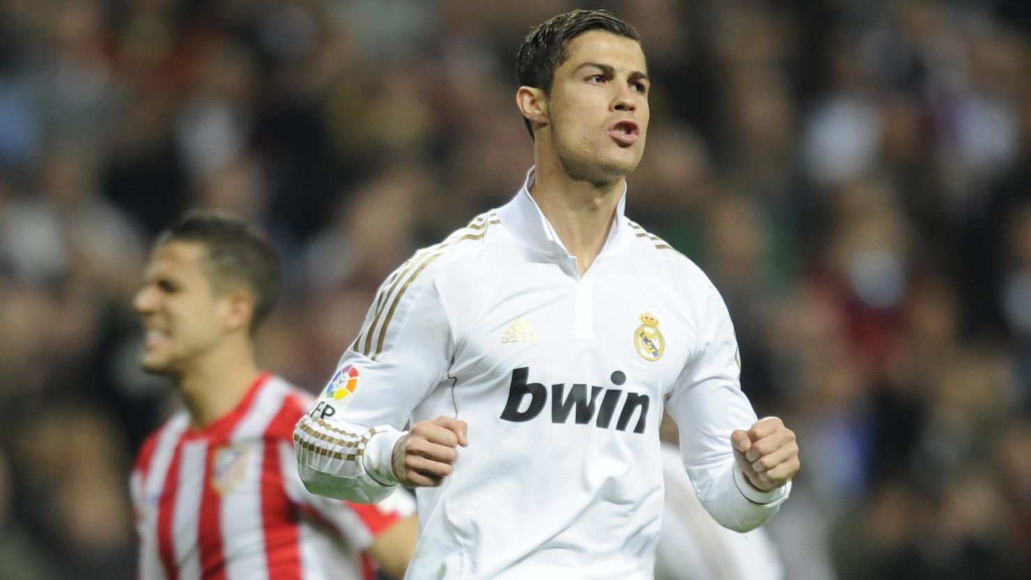 Real Madrid forward Cristiano Ronaldo celebrates after scoring a penalty against Atletico at the Santiago Bernabeu.