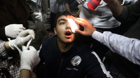 A protester is treated on November 20 in Tahrir Square. At least five demonstrators have been shot in the eye, authorities say.