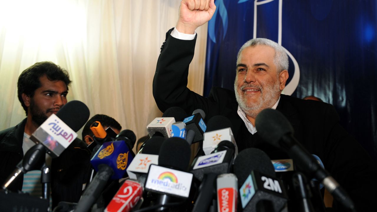 Abdelilah Benkirane, general secretary of the Justice and Development Party, raises his fist in victory during a news conference in Rabat, Morocco,  on Sunday.