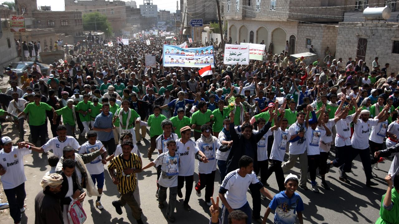 Yemeni anti-government protesters march in Sanaa demanding the trial of Ali Abdullah Saleh on November 26, 2011.