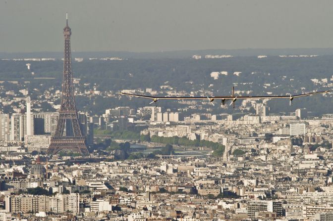 The Solar Impulse soars high above the streets of Paris in 2012.