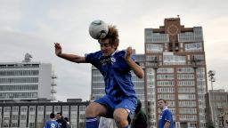 An amateur soccer player in Brooklyn 'heads' the ball. 