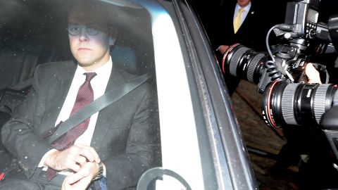 BSkyB Chairman James Murdoch (L) leaves the company's annual general meeting in London, on November 29, 2011. 