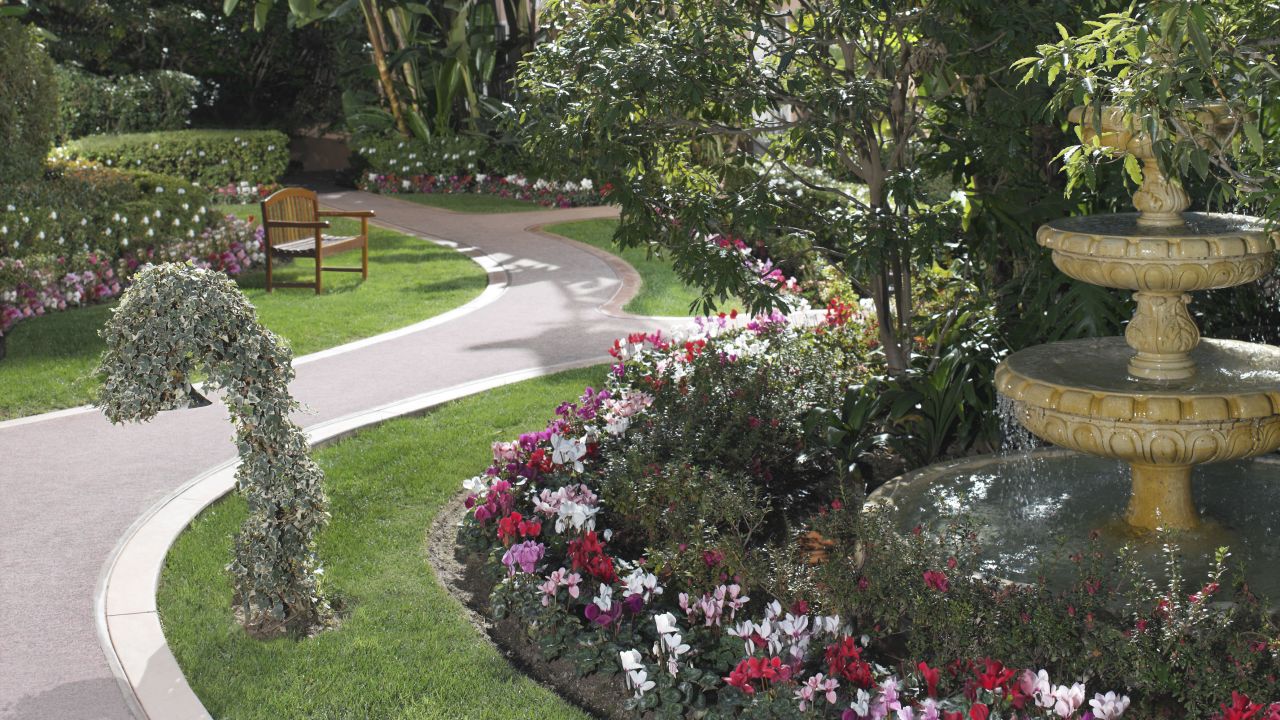 Lushly landscaped gardens and pathways lead to the bungalows.
