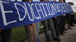 Protestors in support of the Dream Act held a sign that said, "Education not deportation."