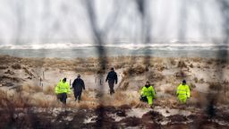 Suffolk County Police search an area of beach in April in Babylon, New York, near where police had found other human remains.