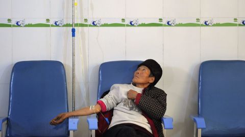 An elderly  AIDS patient is treated at a clinic in Fuyang, in east China's Anhui province on November 28, 2011.