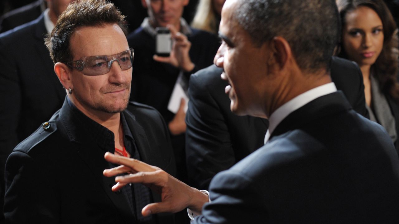 Bono greets President Barack Obama at a World AIDS Day event in Washington in December 2011.