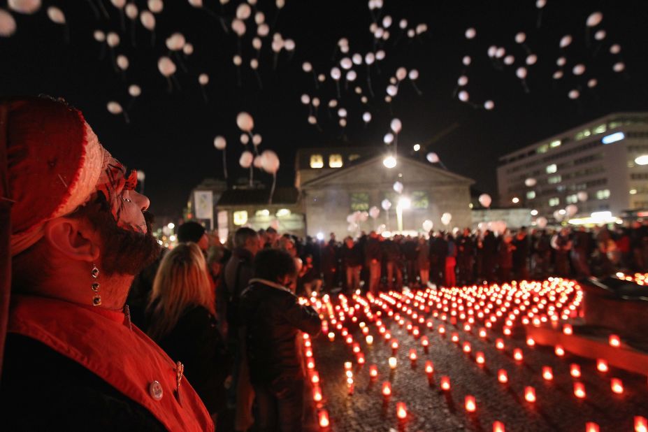 Balloons are released next to a sea of candles at the World Aids Day memorial in Berlin on November 30, 2011.