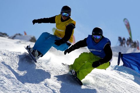 Release a few endorphins, improve your flexibility and work on major muscle groups in your legs -- such as hamstrings, calves and quads -- as you burn at least 450 calories an hour snowboarding or skiing.  Studies show that outdoor exercise can also improve moods and reduce levels of anxiety.