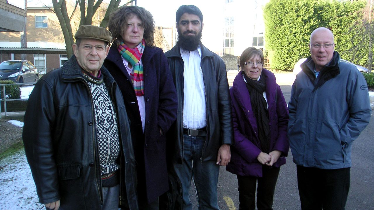 Warren Weinstein is at left with Ali Amjad (center), Mark Wilkinson and Waste Management staff members.