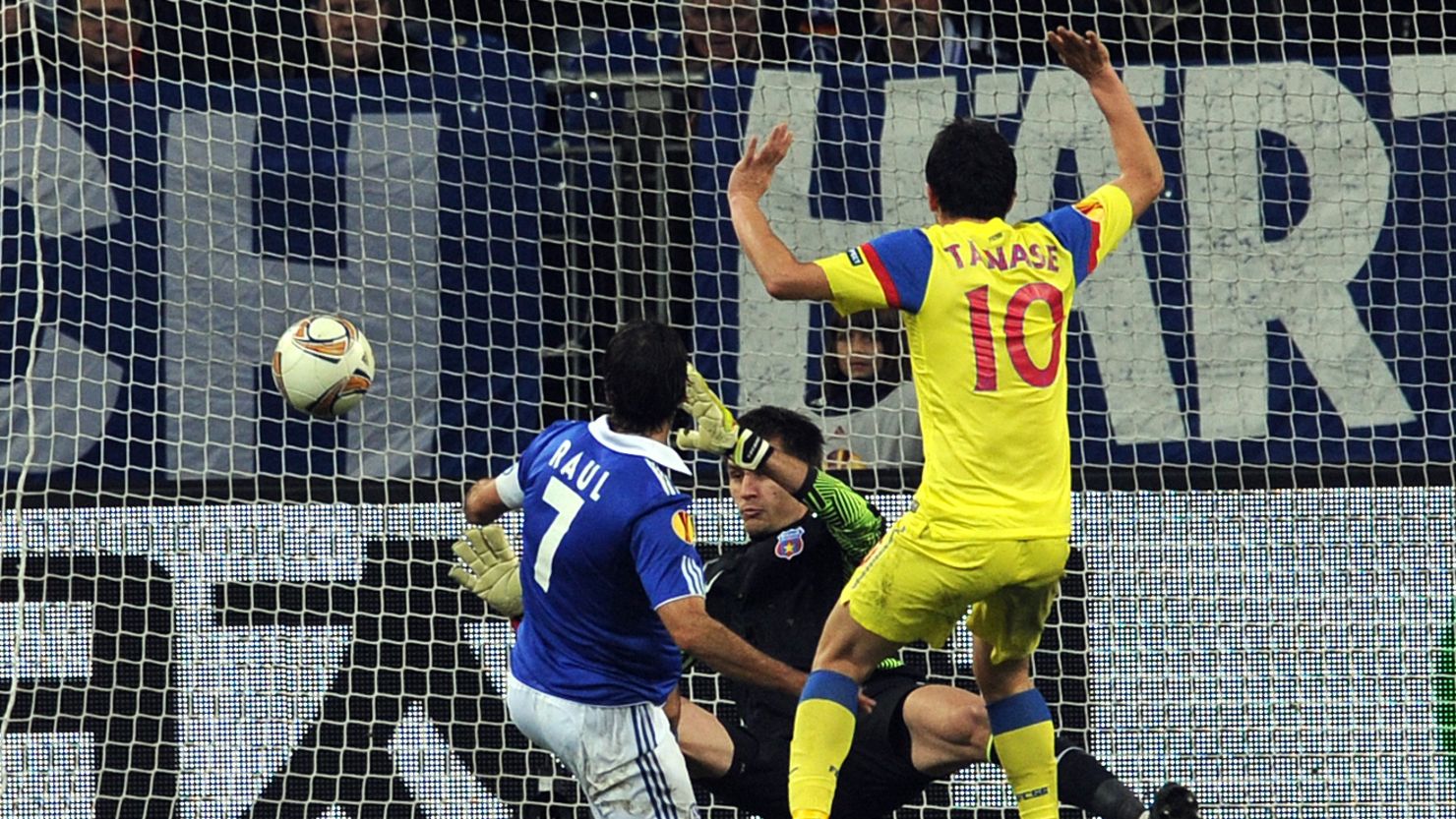 Schalke striker Raul beats Steaua Bucharesti goalkeeper Ciprian Tatarusanu in Gelsenkirchen on Thursday.