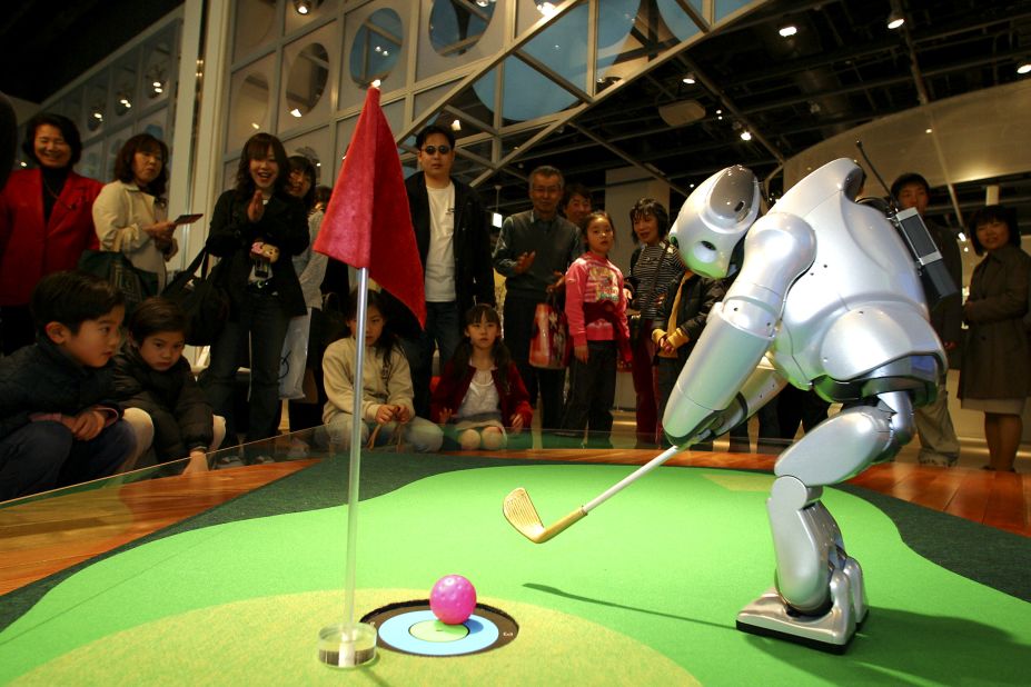Sony's prototype robot golfer Qrio shows off its skills during a technology exhibition in Japan.