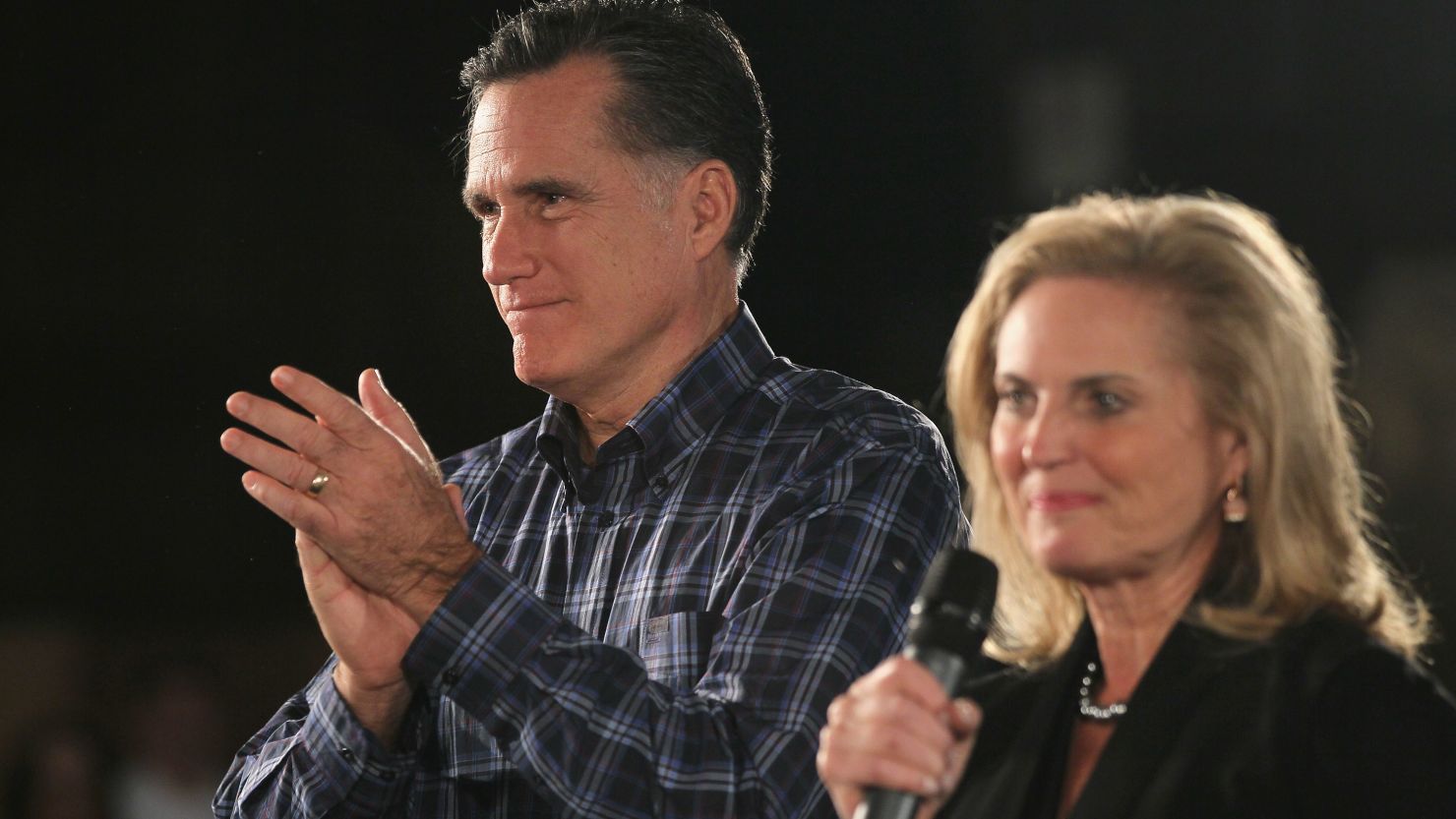 Mitt Romney applauds his wife Ann as she addresses a crowd gathered for a campaign rally at the American Polish Cultural Center on November 10 in Troy, Michigan. 
