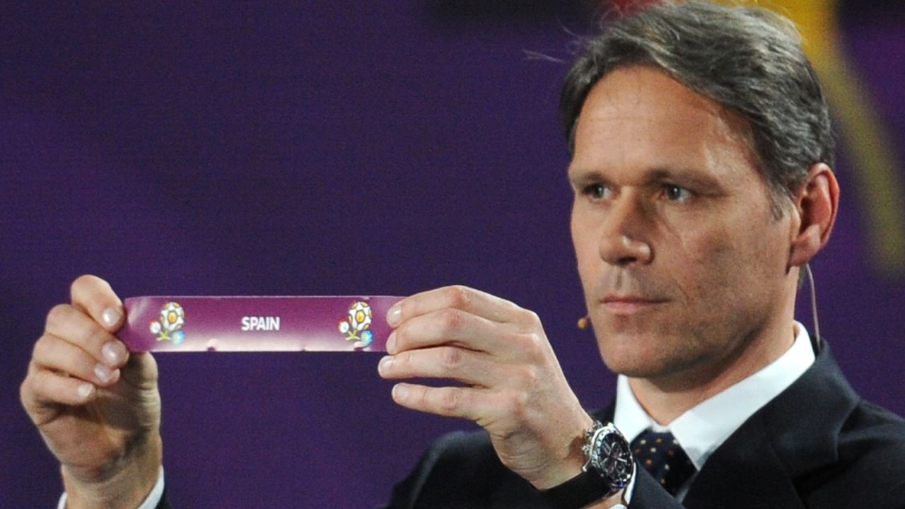 Dutch football legend Marco van Basten holds up the ballot paper of Spain during Friday's Euro 2012 draw in Kiev.