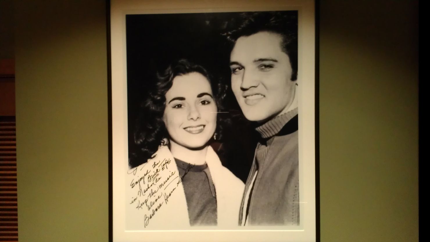 A photo of a young Elvis and his hometown sweetheart, Barbara Hearn, hangs in a Florida restaurant, whose owner is a fan.