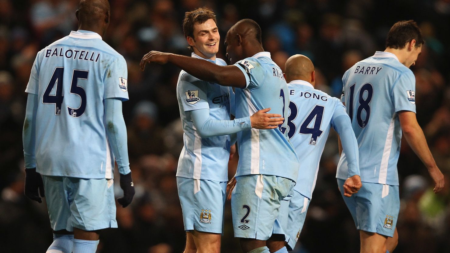Adam Johnson is congratulated by his team mates after scoring the fifth goal in Manchester City's 5-1 rout of Norwich City